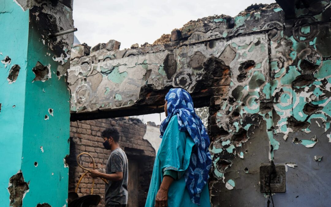 A rubble of dreams, home lost to gunfight, she waits for jailed husband